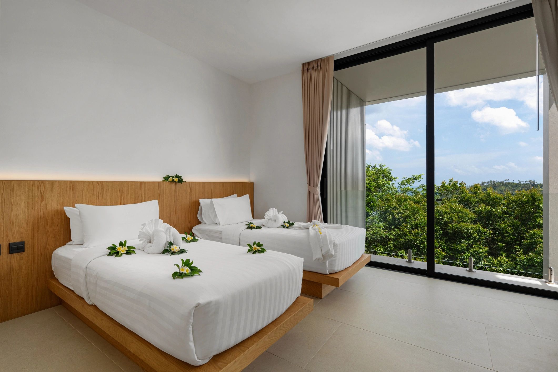 Bright tropical hotel room with twin beds
